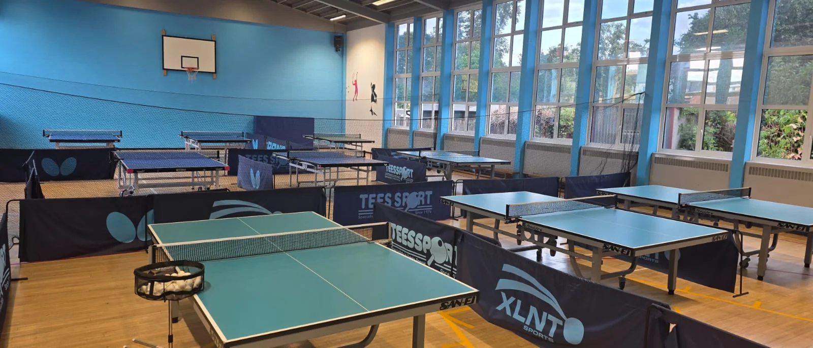 Table tennis tables and surrounds prepared for play at Pankhurst Gym